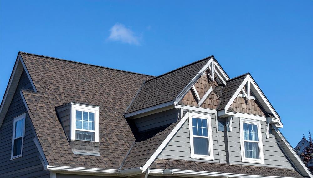 A new home with dark gray shingles.